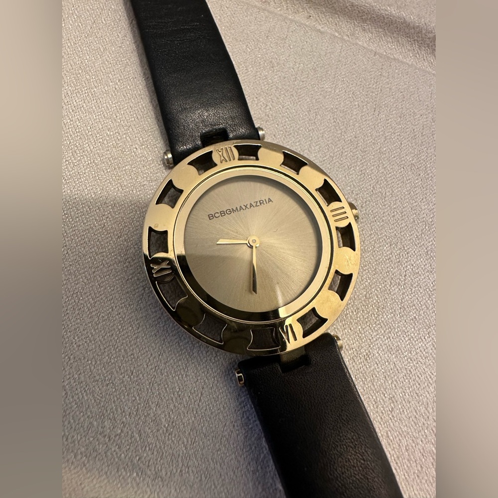 BCBGMaxAzria gold tone watch with black strap